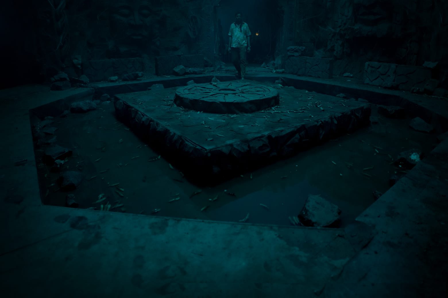 The altar of the kund — a man with a torch